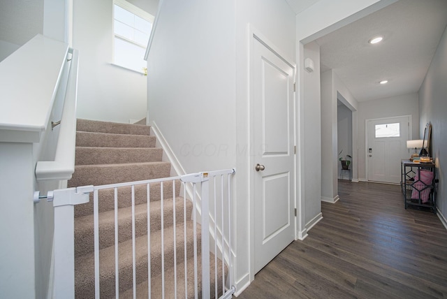 stairway featuring hardwood / wood-style floors