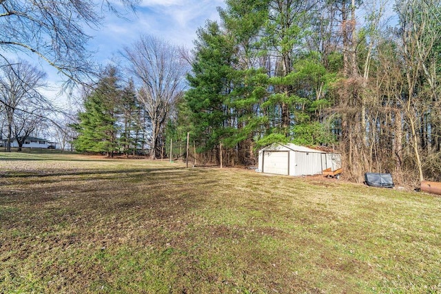 view of yard with an outbuilding and a shed