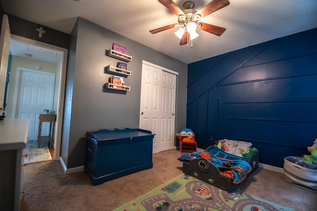 carpeted bedroom with ceiling fan