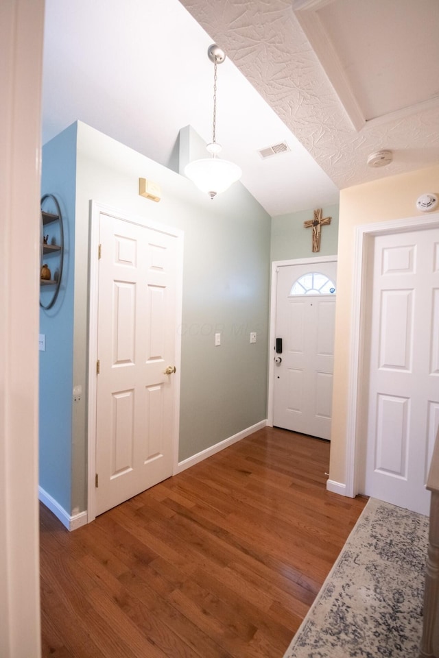 entrance foyer featuring dark wood-type flooring