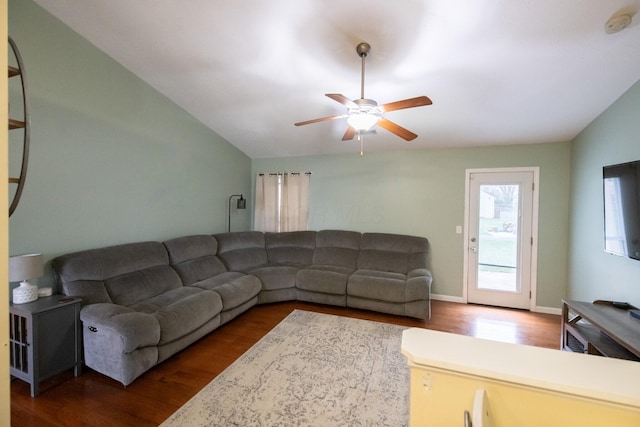 living room featuring vaulted ceiling, hardwood / wood-style floors, and ceiling fan