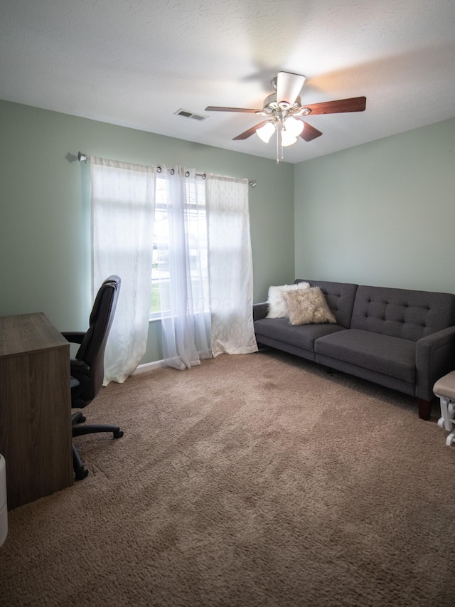 office space with carpet floors and ceiling fan