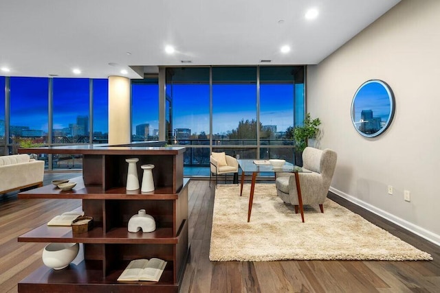 living room with hardwood / wood-style flooring and floor to ceiling windows