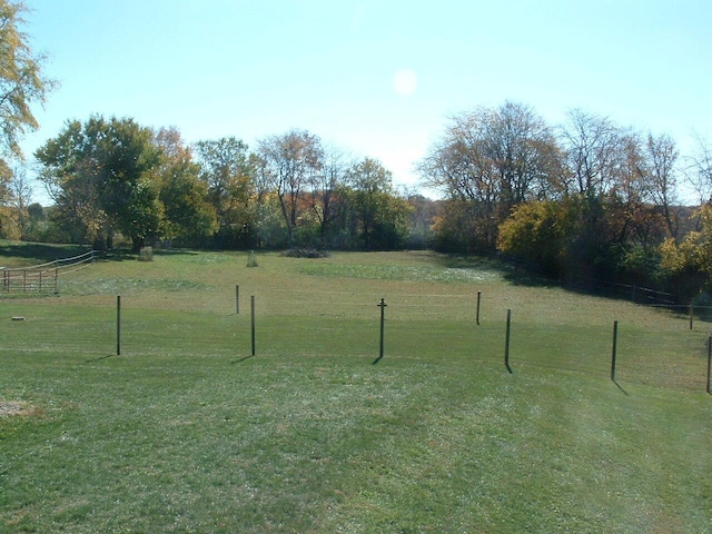 view of yard with a rural view