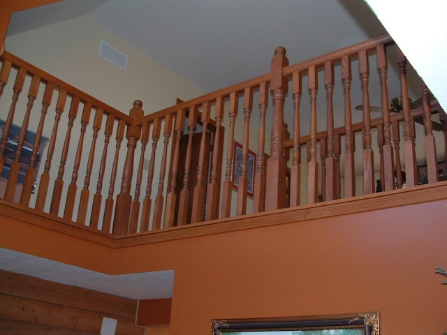 staircase featuring a towering ceiling