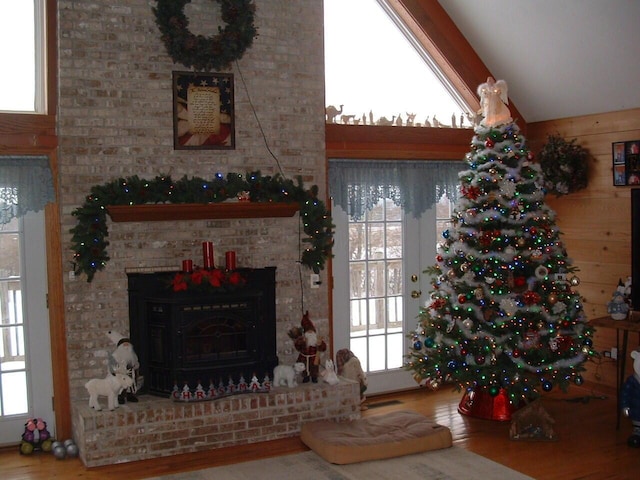 living room with hardwood / wood-style floors and vaulted ceiling