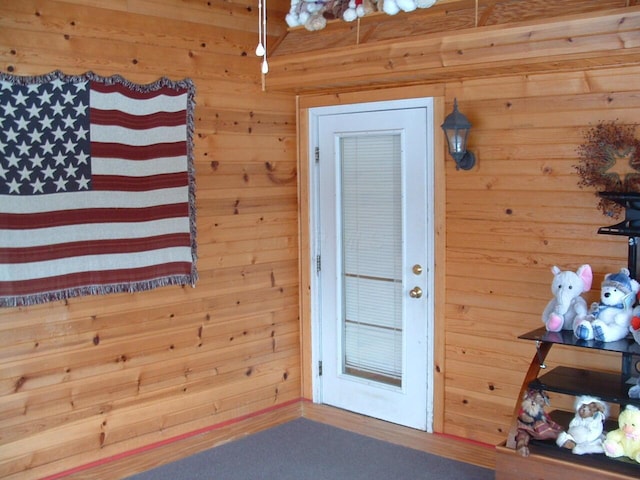 doorway with wooden walls