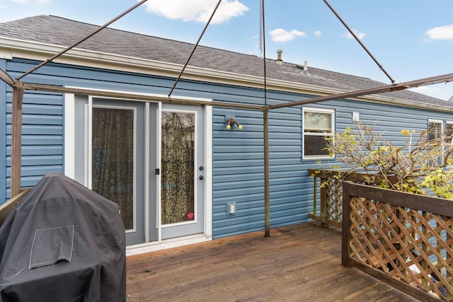 wooden terrace featuring a grill