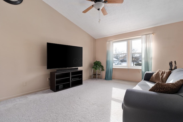 living room featuring lofted ceiling, light carpet, a textured ceiling, and ceiling fan