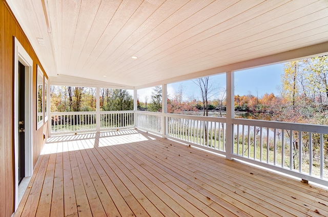 wooden deck featuring a water view