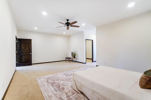 bedroom with light colored carpet and ceiling fan