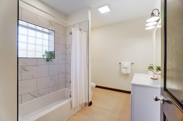 full bathroom featuring hardwood / wood-style flooring, vanity, toilet, and shower / bath combo