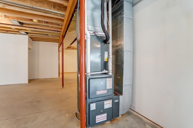 utility room with heating unit