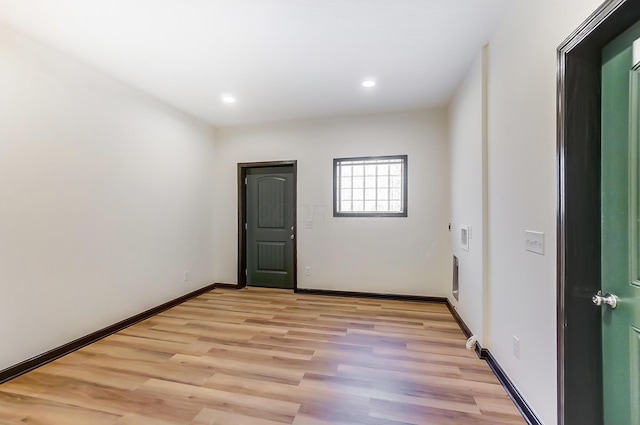 spare room with light wood-type flooring