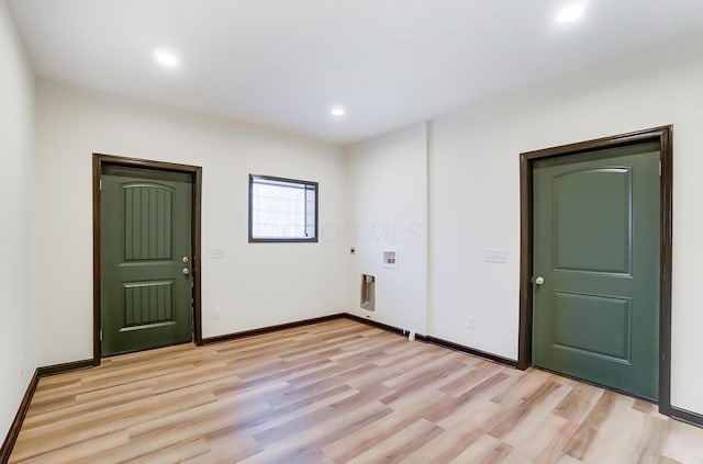 unfurnished room with light hardwood / wood-style flooring