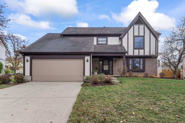 view of front of home featuring a front lawn and a garage