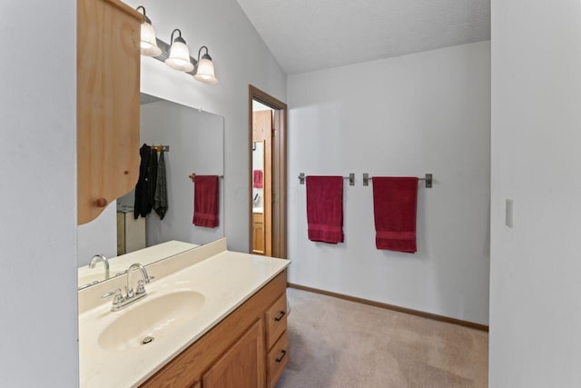 bathroom with vanity and a textured ceiling