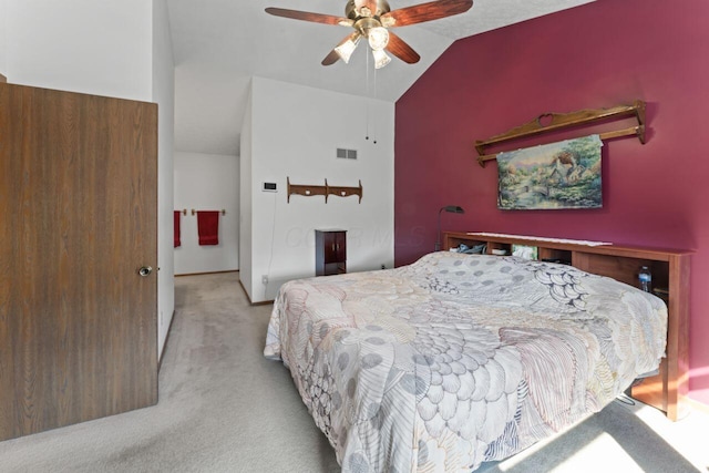 carpeted bedroom featuring ceiling fan and vaulted ceiling