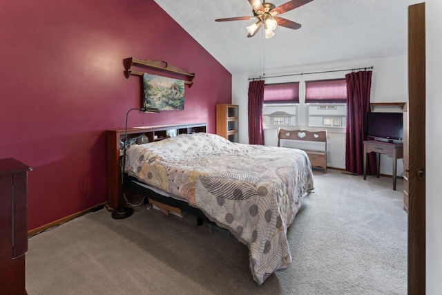 bedroom featuring ceiling fan, light carpet, and vaulted ceiling