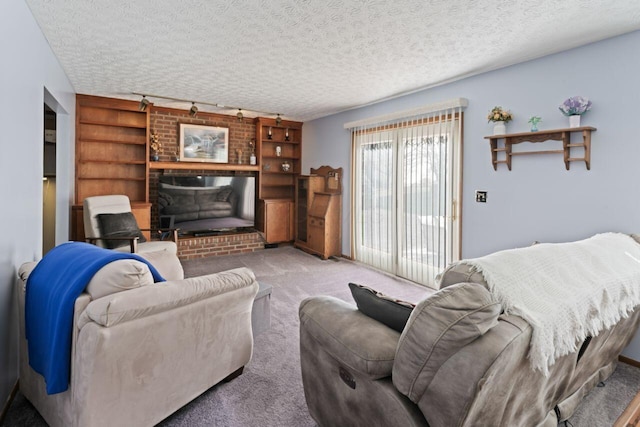 living room featuring a textured ceiling, light carpet, and track lighting