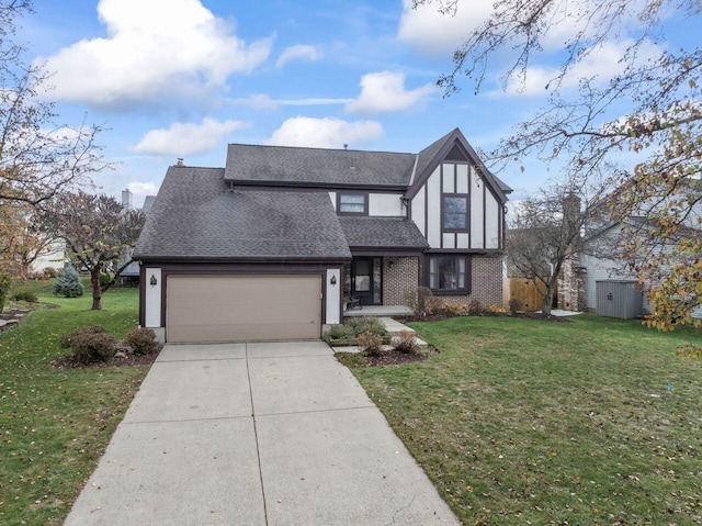 view of front of home with a garage and a front lawn