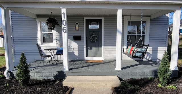 property entrance with covered porch