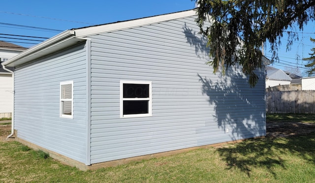 view of property exterior with a lawn