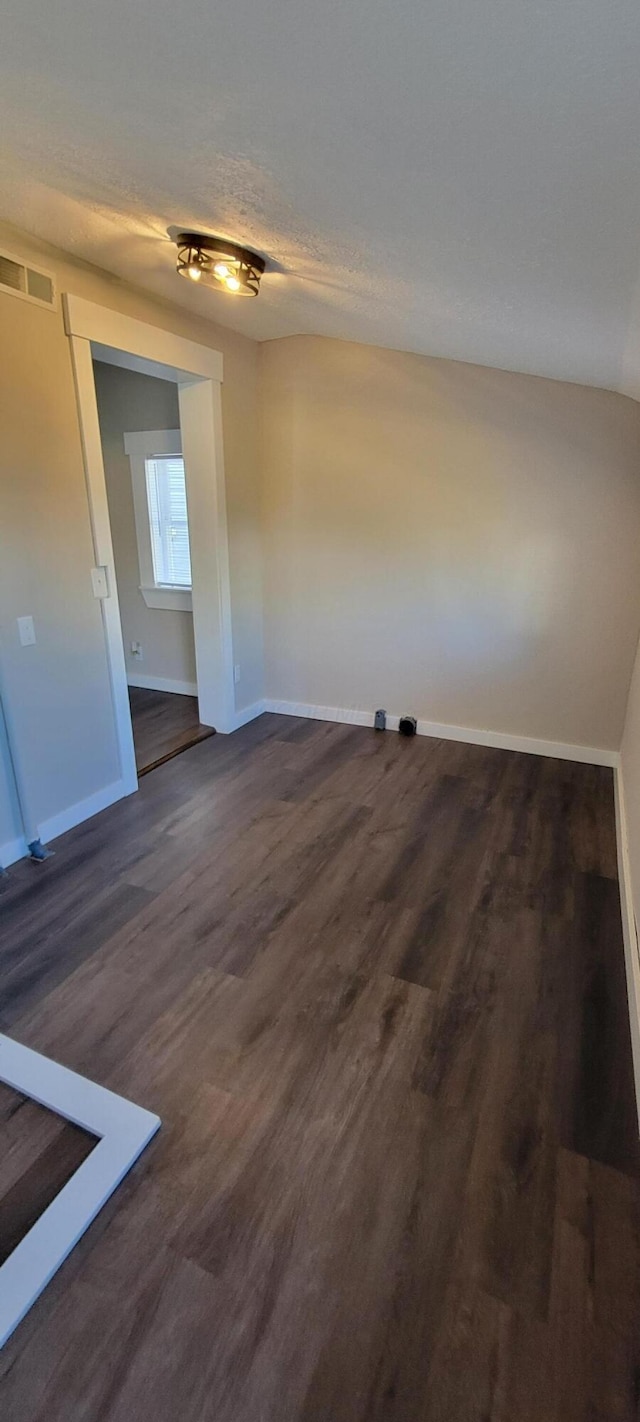 unfurnished room featuring dark hardwood / wood-style floors