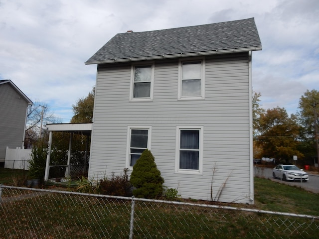 view of side of property with a yard