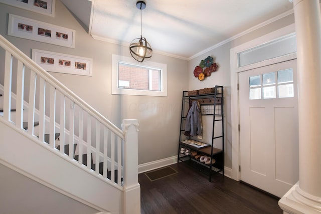 foyer with dark hardwood / wood-style flooring and ornamental molding