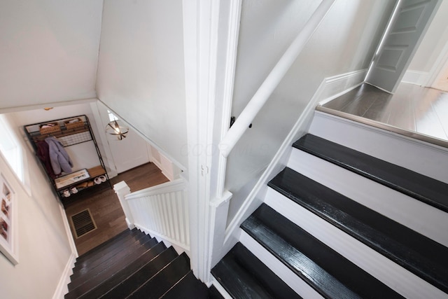 stairway with wood-type flooring