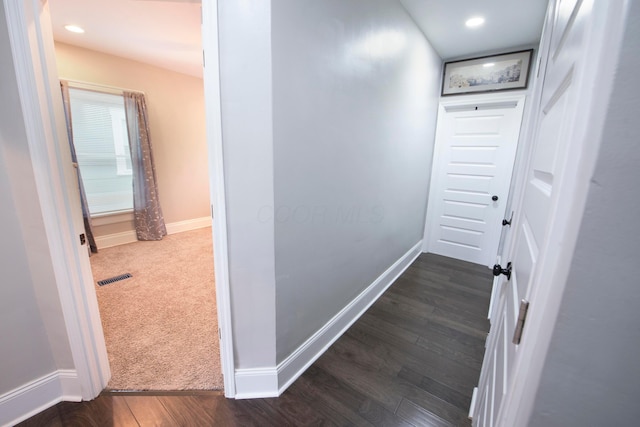 corridor with dark wood-type flooring