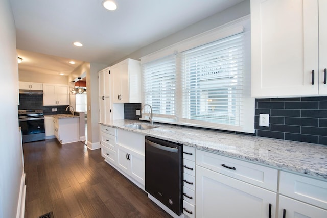 kitchen featuring stove, light stone counters, sink, dishwasher, and white cabinetry