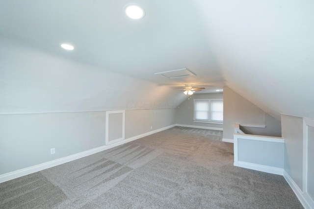 additional living space with carpet flooring and lofted ceiling