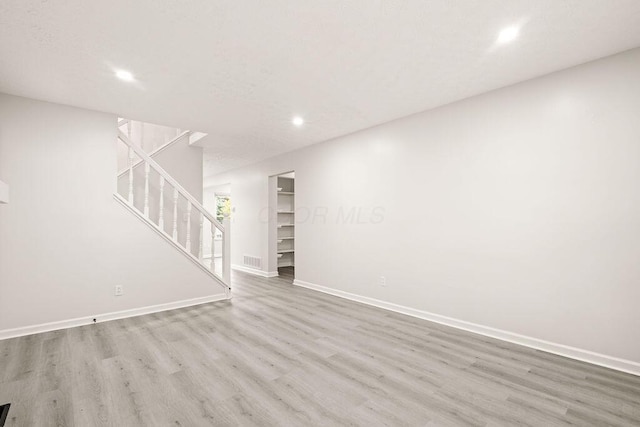 unfurnished living room featuring light hardwood / wood-style flooring