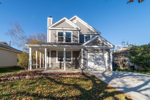 view of front facade featuring a garage and covered porch