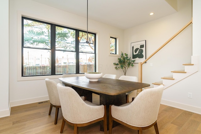 dining area featuring a wealth of natural light and wood-type flooring