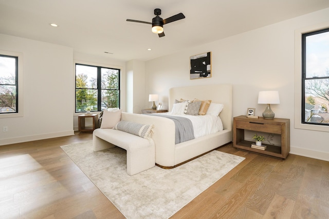 bedroom featuring ceiling fan and light wood-type flooring