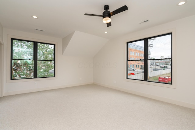 additional living space with carpet floors, vaulted ceiling, and ceiling fan