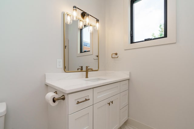 bathroom with vanity and toilet