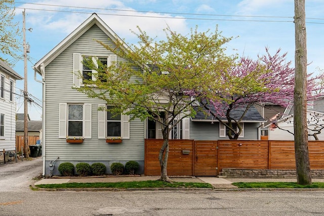 traditional home with a fenced front yard