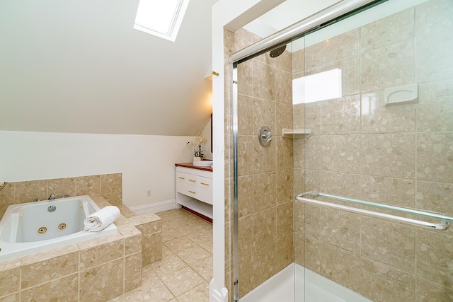 bathroom featuring a whirlpool tub, vaulted ceiling with skylight, a stall shower, and tile patterned flooring