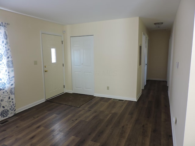 foyer entrance with dark wood-type flooring