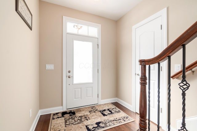 foyer entrance with hardwood / wood-style flooring