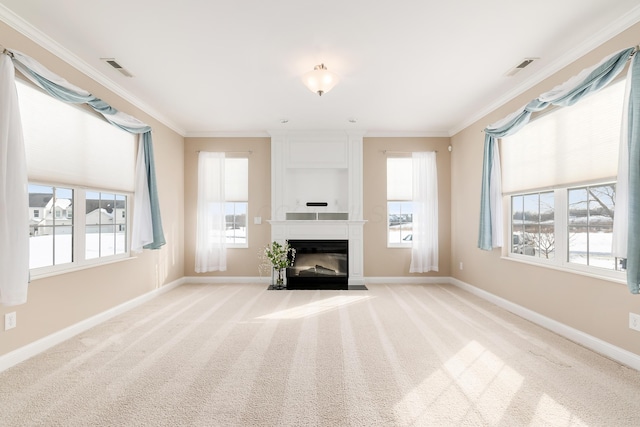 unfurnished living room with ornamental molding, light carpet, and a fireplace