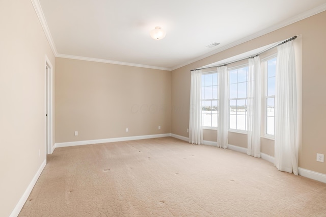 carpeted empty room featuring crown molding