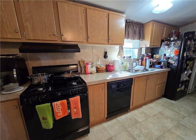 kitchen with black appliances, light tile patterned floors, and sink