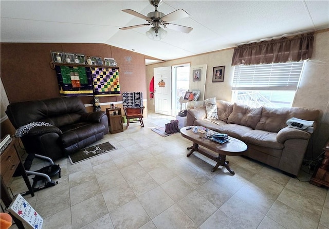 living room with ceiling fan and vaulted ceiling