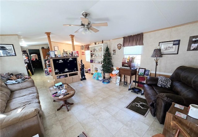 living room featuring ornate columns and ceiling fan