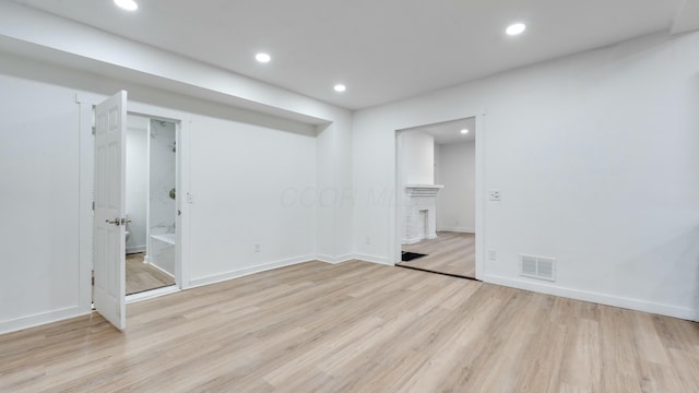 unfurnished room with light hardwood / wood-style floors